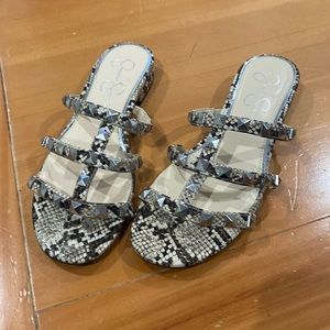 Snake print flat sandals.